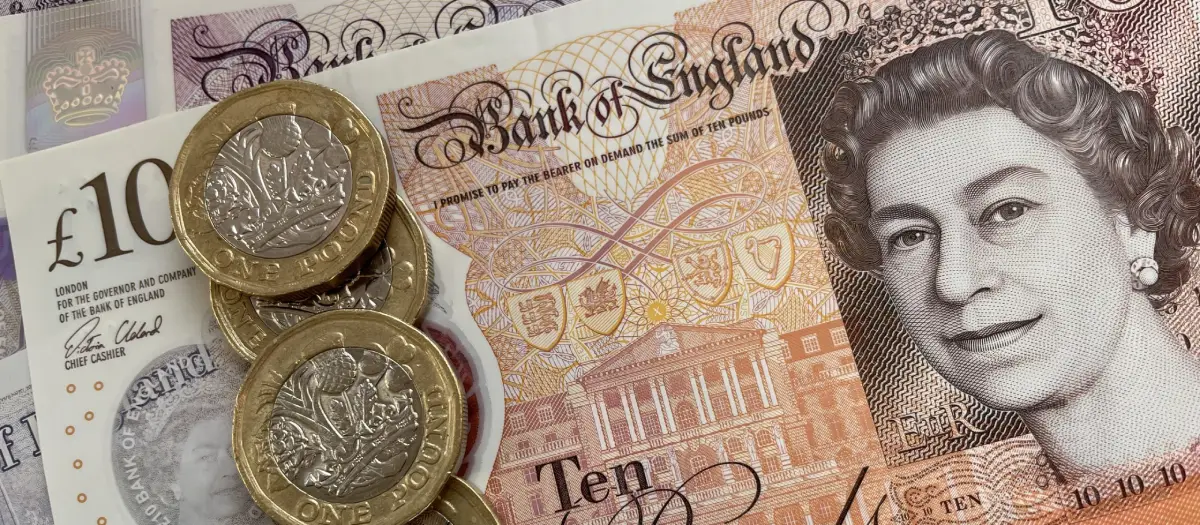 British pound notes and a sturdy home safe